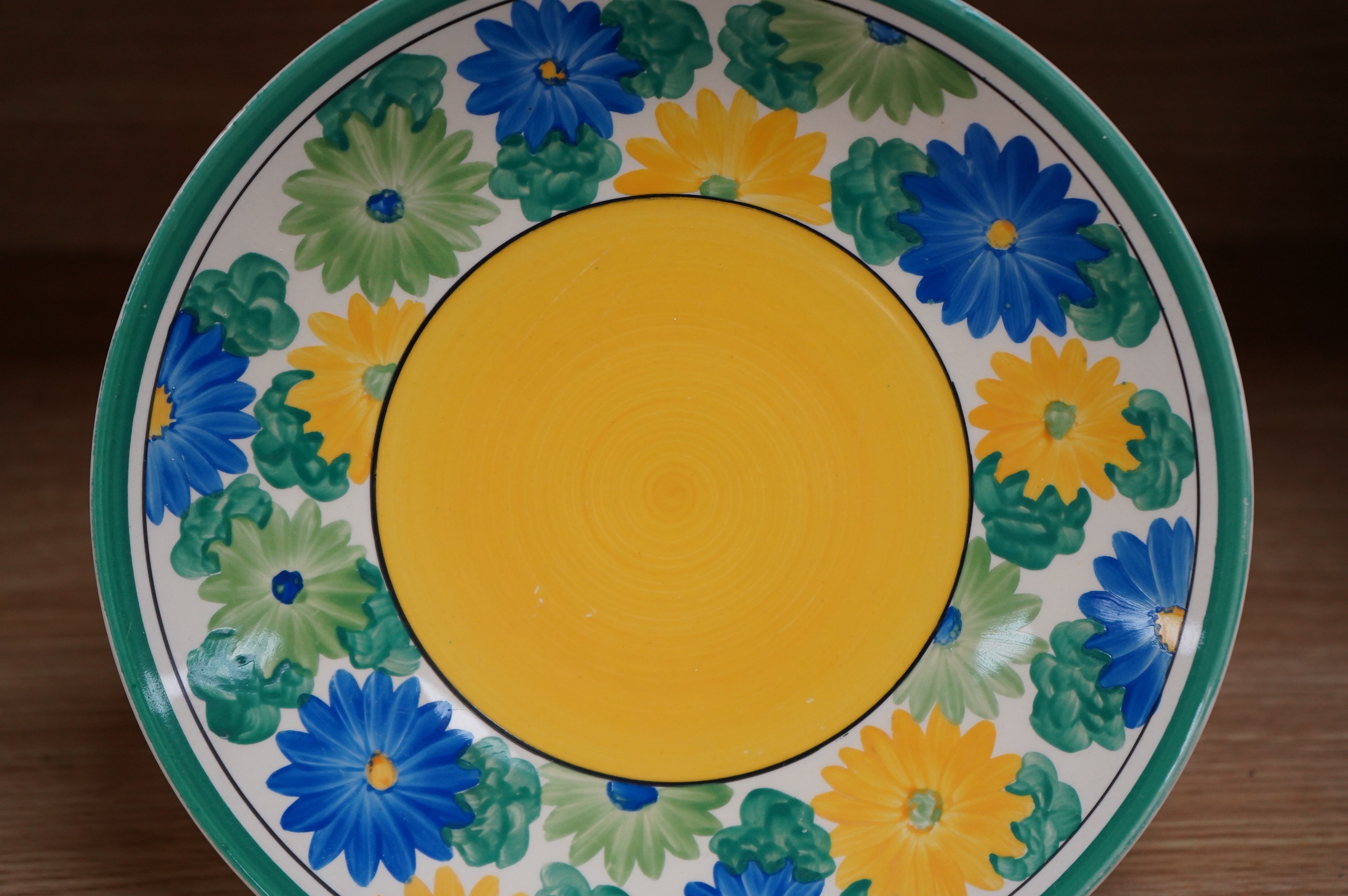 A Clarice Cliff Bizarre Sungay plate, 23cm diameter. Condition - light wear